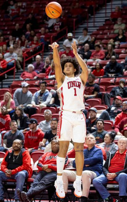 UNLV forward Jalen Hill (1) attempts a three-point shot during the college basketball game agai ...