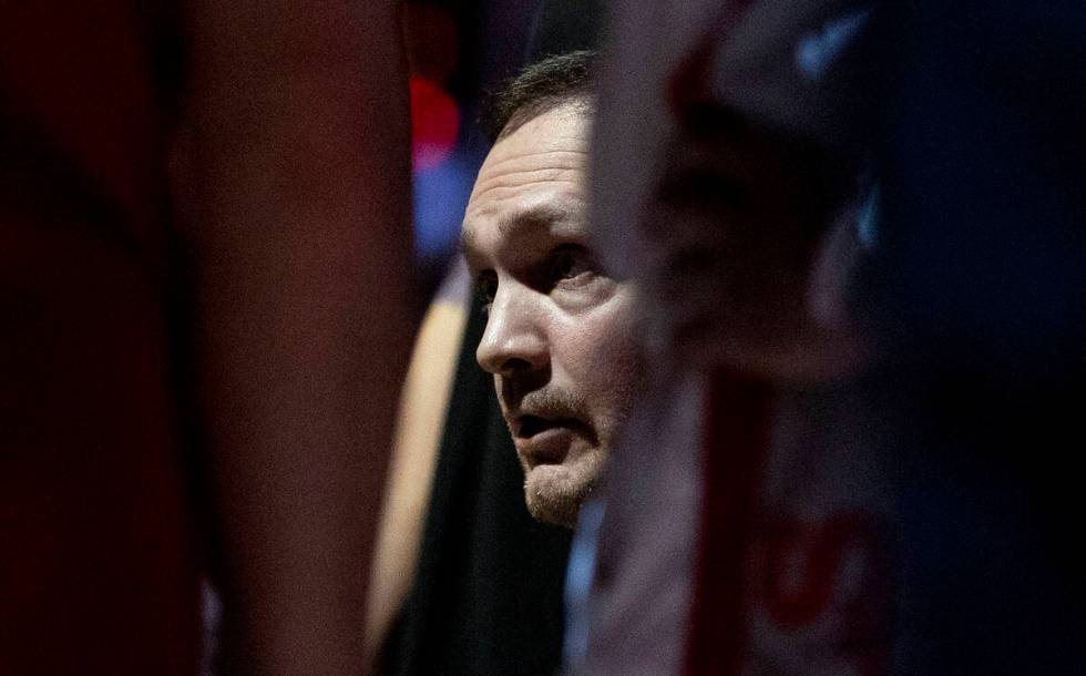 UNLV head coach Kevin Kruger talks to the team during the college basketball game against the O ...