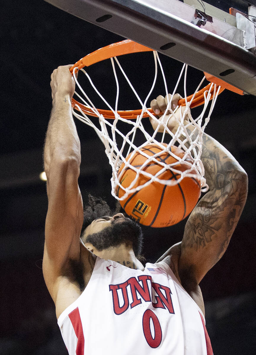 UNLV forward Isaiah Cottrell (0) dunks the ball during the college basketball game against the ...