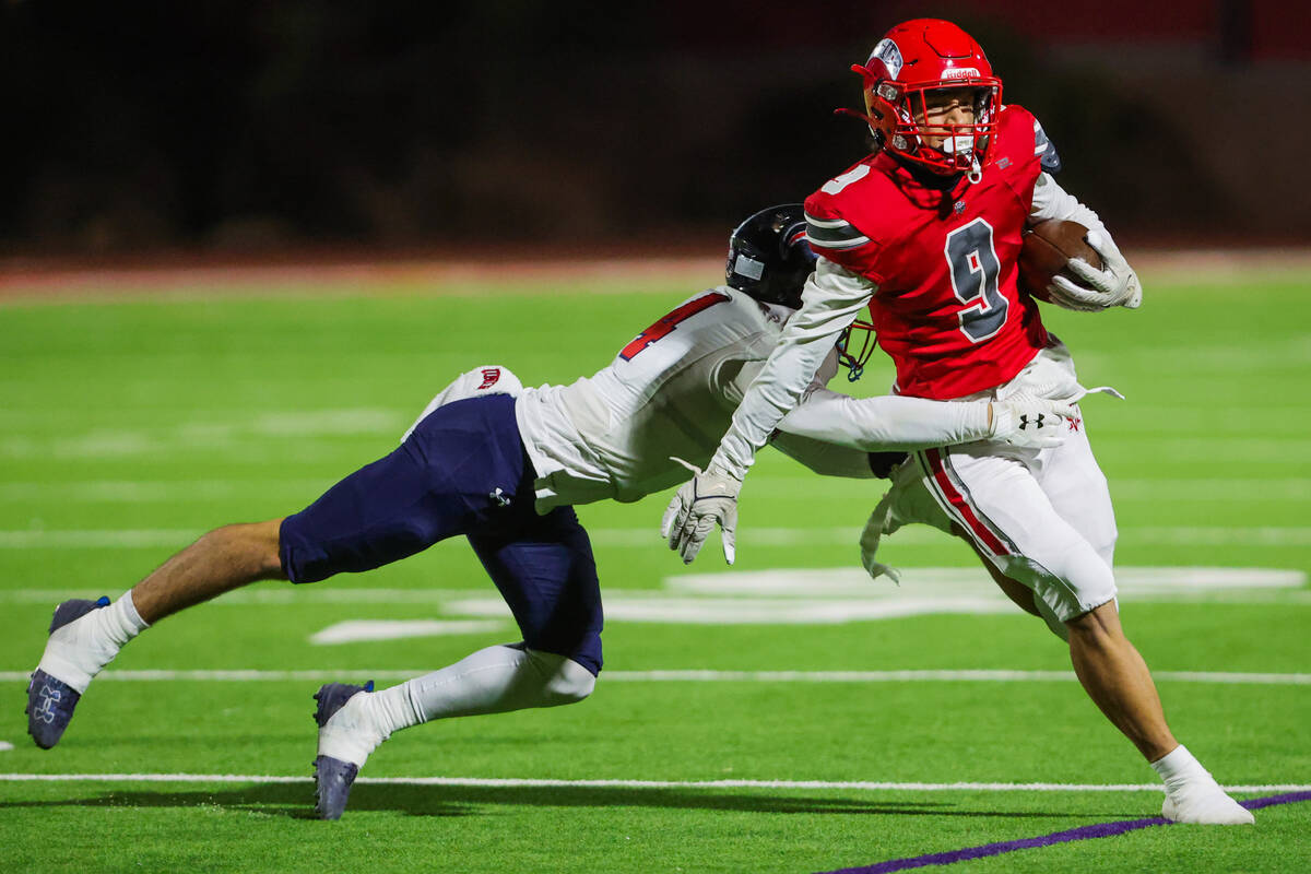 Arbor View wide receiver Kai Cypher (9) runs the ball as Coronado free safety Jackson Humphrie ...