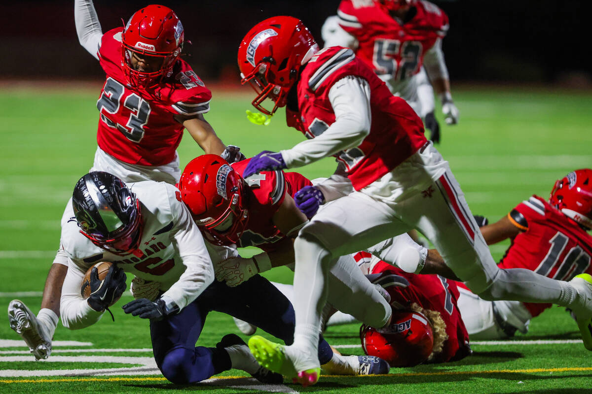 Coronado athlete JJ Buchanan (6) goes down with the ball during a Class 5A Division I state sem ...