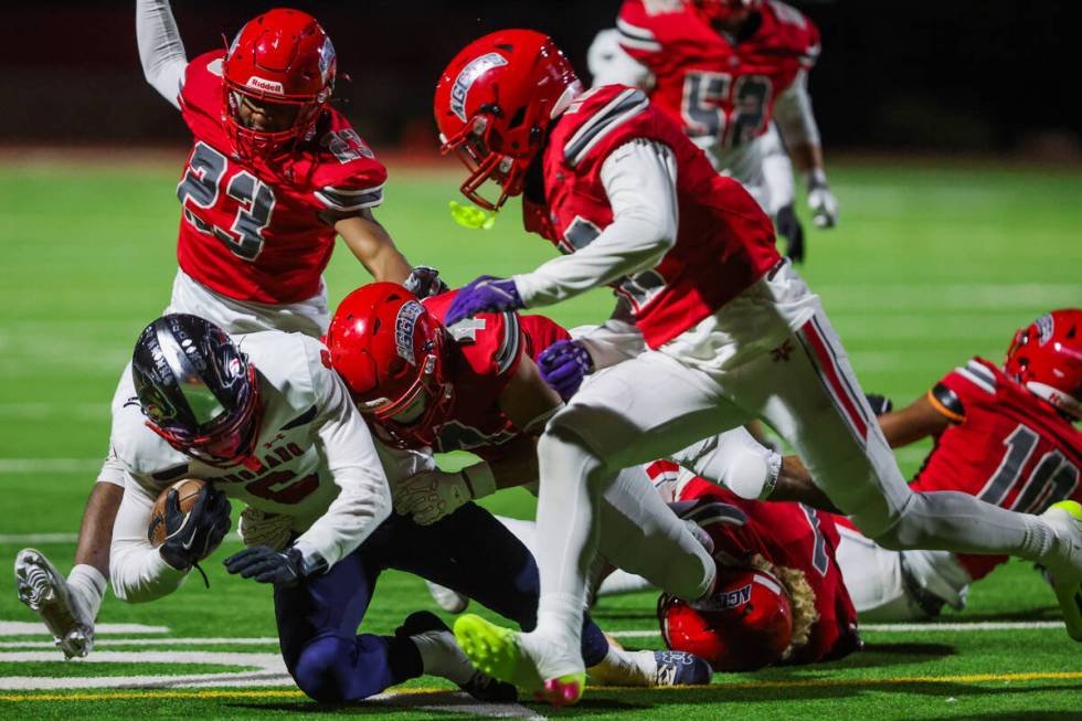 Coronado athlete JJ Buchanan (6) goes down with the ball during a Class 5A Division I state sem ...