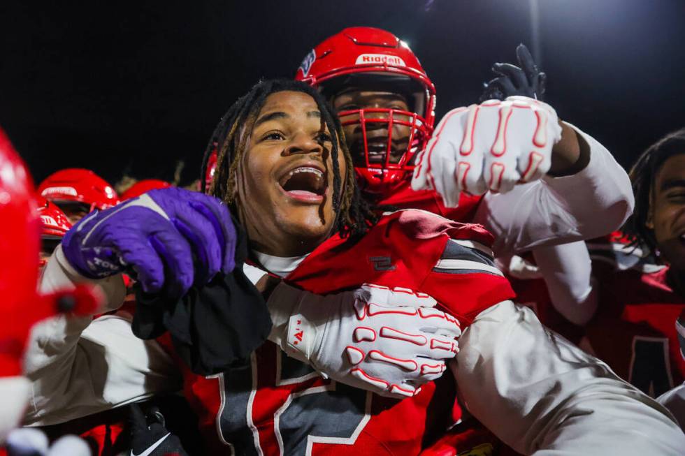 Arbor View teammates celebrate winning a Class 5A Division I state semifinal football game betw ...