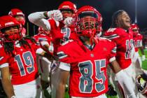 Arbor View teammates celebrate winning a Class 5A Division I state semifinal football game betw ...