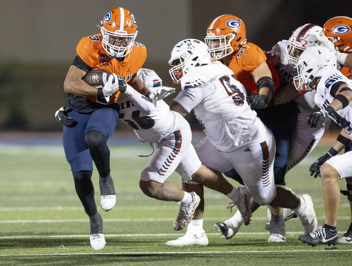 Bishop Gorman running back Terrance Grant (3) avoids tacklers during the Class 5A Division I st ...