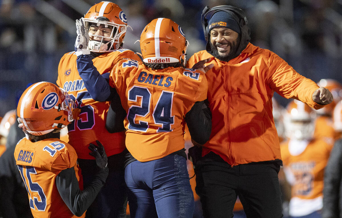 Bishop Gorman running back Myles Norman (24) celebrates with the sideline after scoring a touch ...