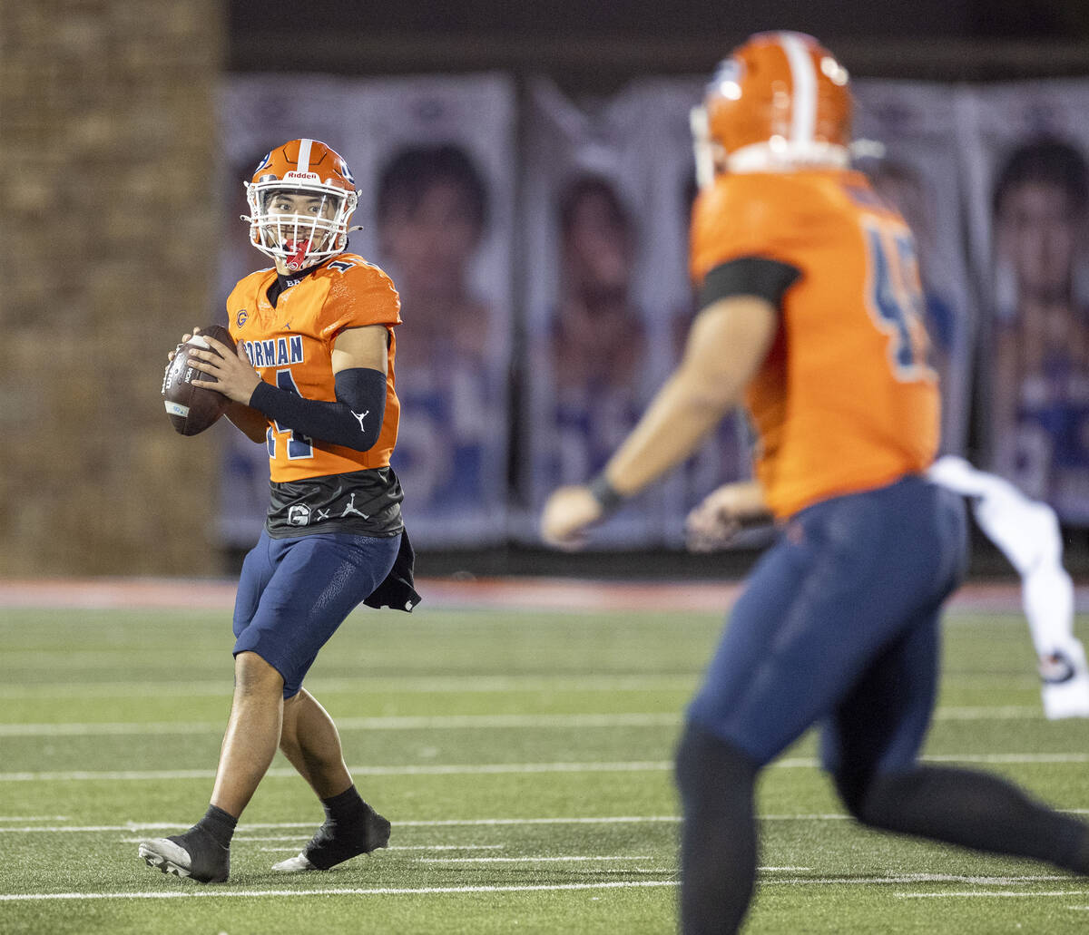 Bishop Gorman quarterback Maika Eugenio (14) looks to throw the ball during the Class 5A Divisi ...