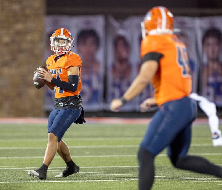 Bishop Gorman quarterback Maika Eugenio (14) looks to throw the ball during the Class 5A Divisi ...