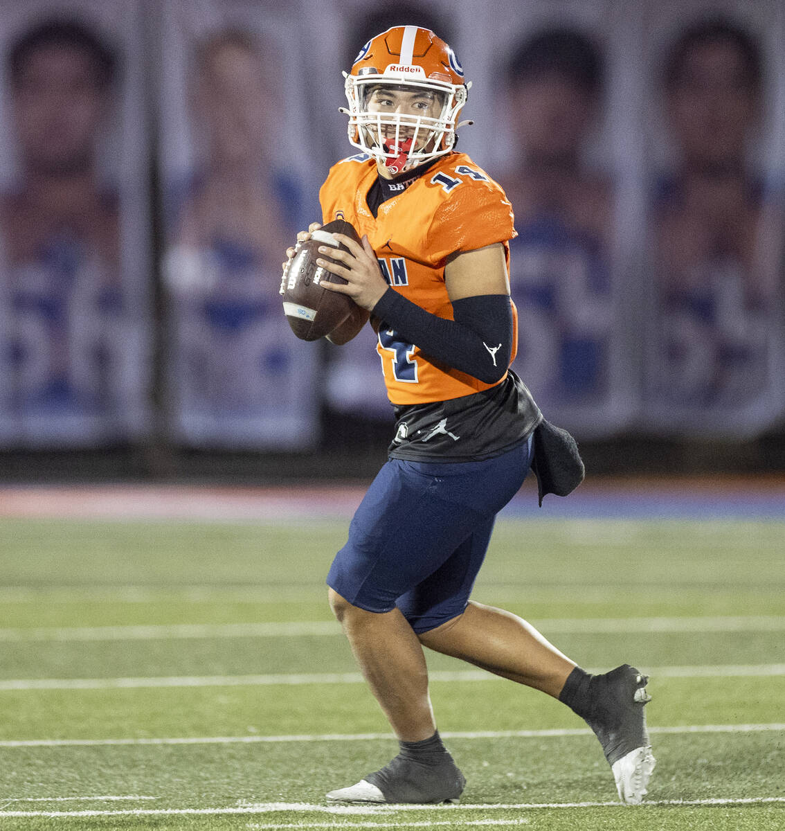 Bishop Gorman quarterback Maika Eugenio (14) looks to throw the ball during the Class 5A Divisi ...