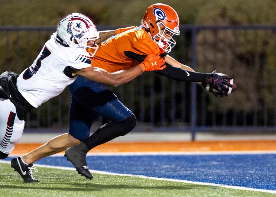 Bishop Gorman wide receiver Kaina Watson, right, stretches for a touchdown as Liberty defensive ...