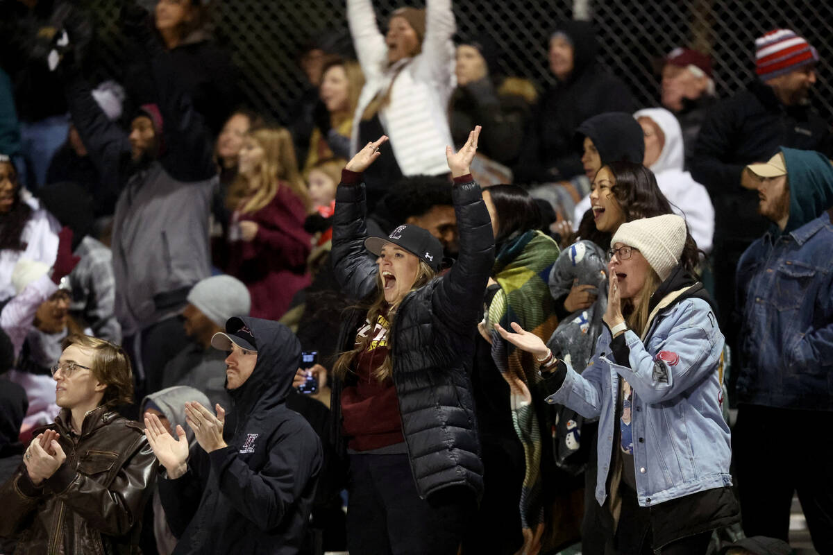 Faith Lutheran fans cheer as their team takes on Shadow Ridge in the fourth quarter of their NI ...