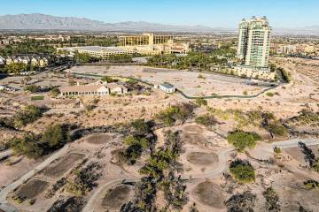 An aerial view of the shuttered Badlands Golf Course and the Queensridge towers, right, on Tues ...