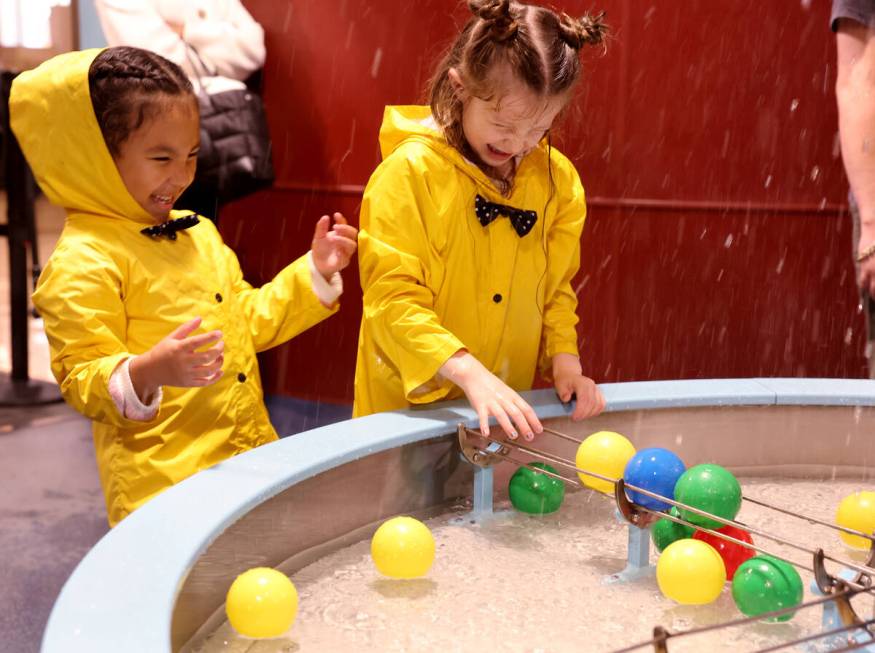 Evelyn Andrikut, 5, of Reno, right, and Journi Maestas, 4, of Las Vegas send balls skyward in a ...