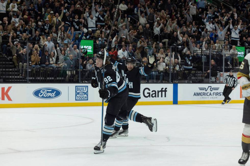 Utah Hockey Club left wing Matias Maccelli (63) celebrates center Logan Cooley's (92) goal agai ...