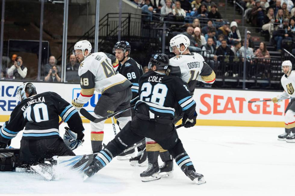 Vegas Golden Knights center Tomas Hertl (48) scores on Utah Hockey Club goaltender Karel Vejmel ...