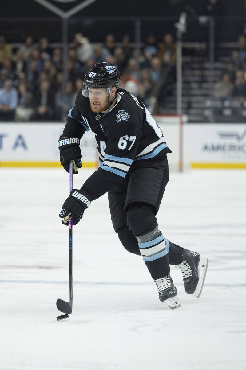 Utah Hockey Club left wing Lawson Crouse (67) moves the puck against Vegas Golden Knights durin ...