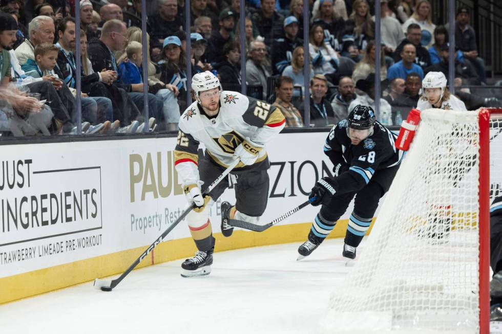 Vegas Golden Knights right wing Cole Schwindt (22) moves the puck against Utah Hockey Club defe ...