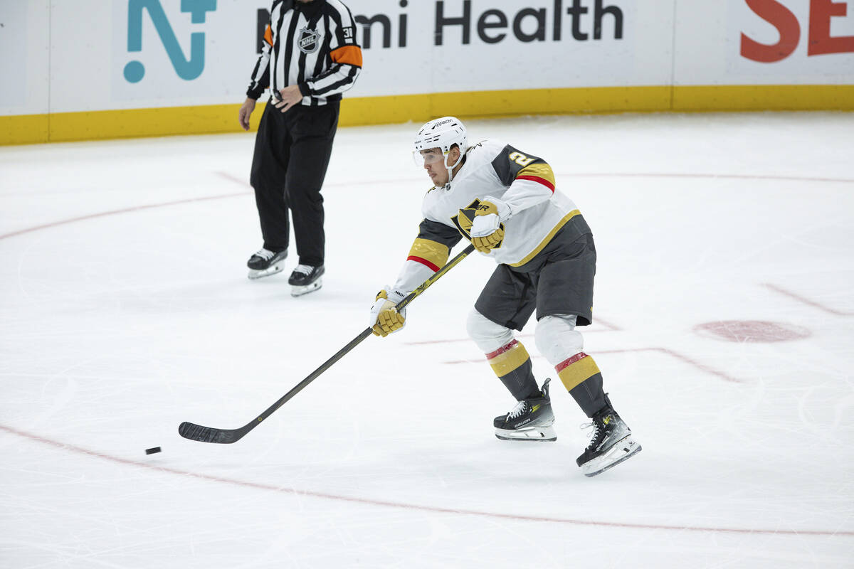 Vegas Golden Knights defenseman Zach Whitecloud (2) shoots the puck against Utah Hockey Club du ...