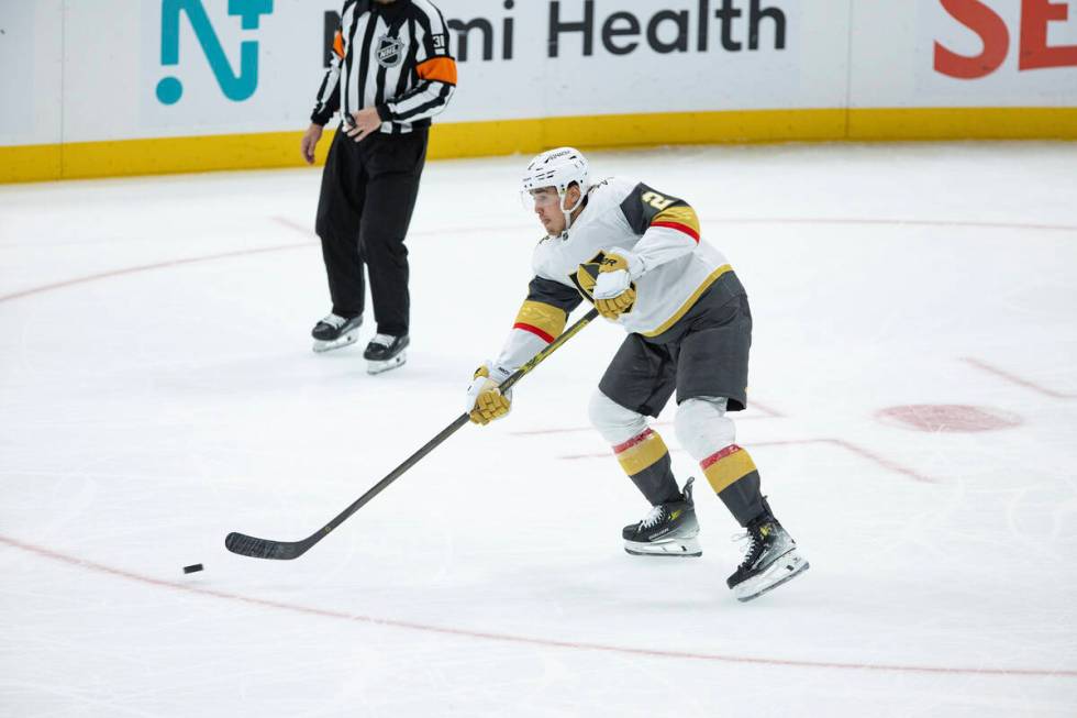 Vegas Golden Knights defenseman Zach Whitecloud (2) shoots the puck against Utah Hockey Club du ...