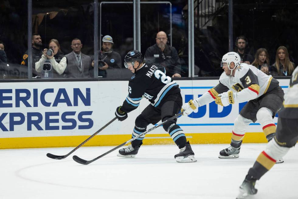 Utah Hockey Club defenseman Olli Maatta (2) controls the puck against Vegas Golden Knights defe ...