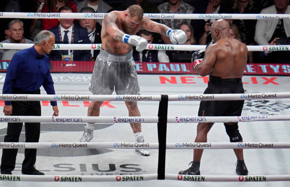 Jake Paul motions towards Mike Tyson during their heavyweight boxing match, Friday, Nov. 15, 20 ...