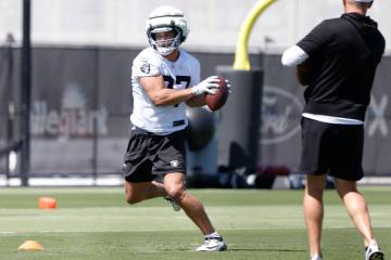 Raiders tight end Michael Mayer catches the ball as he runs through drills during organized tea ...