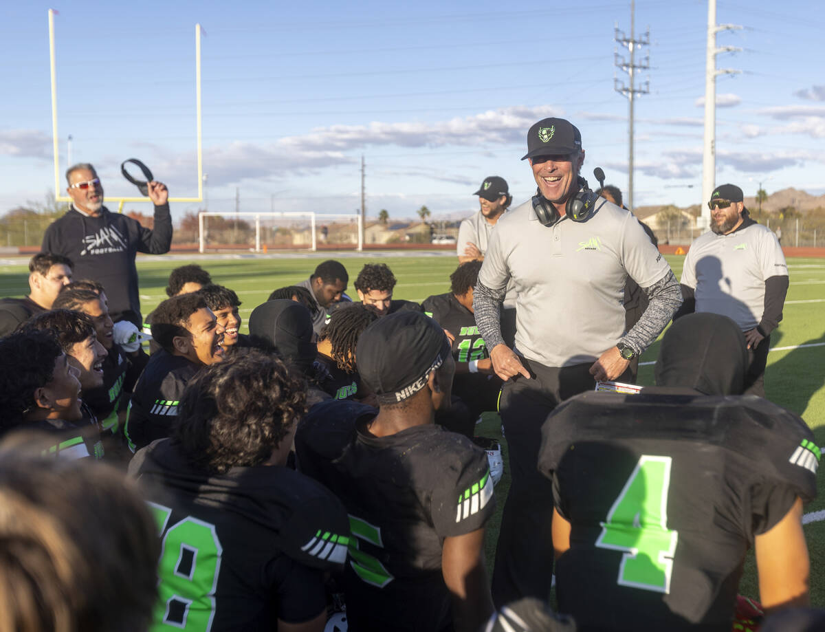 SLAM Academy Head Coach Mike Cofer speaks to the team after winning the 3A state semifinal foot ...