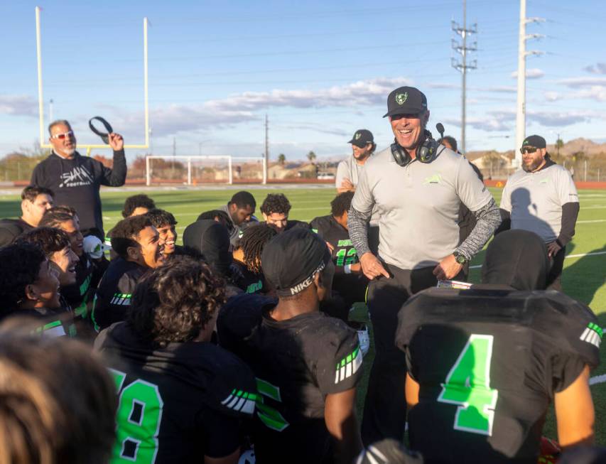 SLAM Academy Head Coach Mike Cofer speaks to the team after winning the 3A state semifinal foot ...