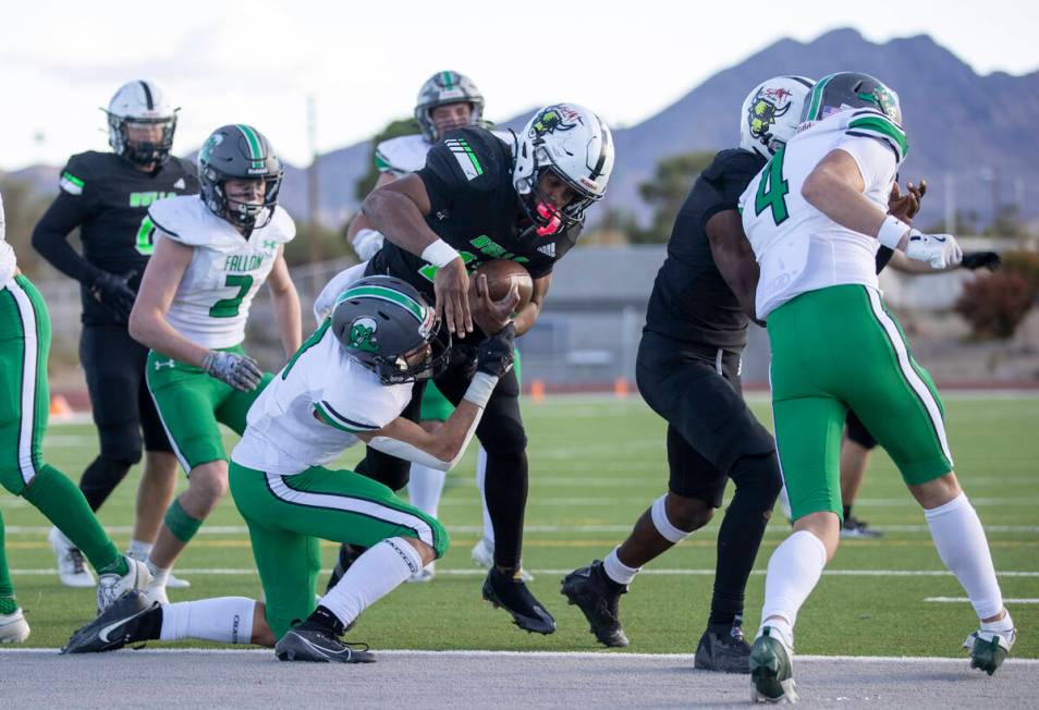 SLAM Academy senior Damien Nevil (12) scores a touchdown during overtime of the 3A state semifi ...