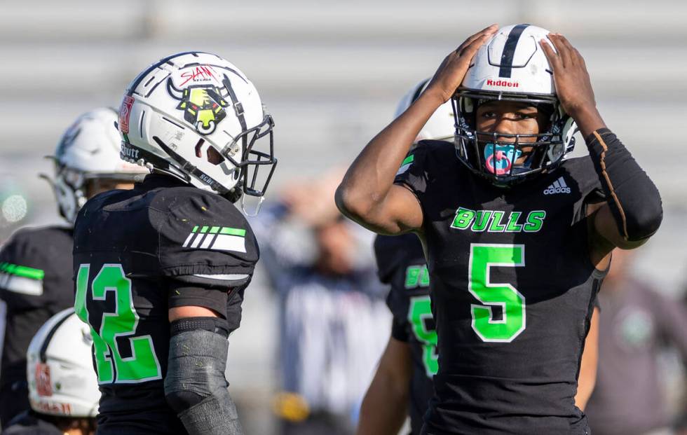 SLAM Academy sophomore Dereon Johnson (5) reacts after a flag is thrown during the 3A state sem ...