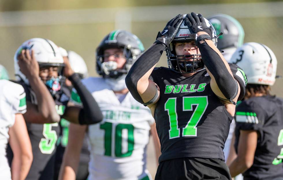 SLAM Academy senior Dylan Tondreau (17) reacts after missing a possible fumble recovery during ...