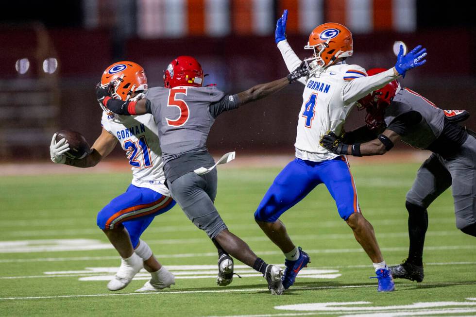 Arbor View cornerback Teddy Johnson (5) attempts to tackle Bishop Gorman running back Jonathan ...