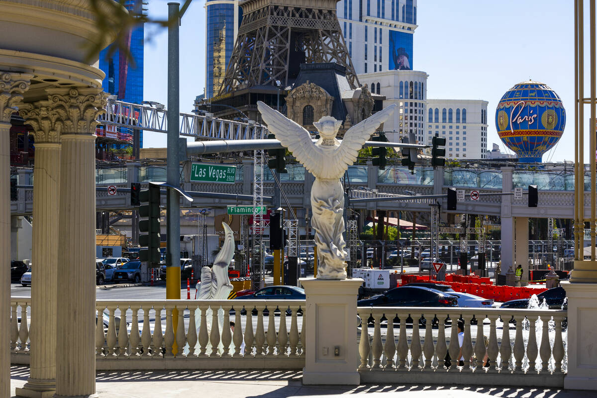 Traffic moves along Flamingo Road at Las Vegas Boulevard about F1 infrastructure along the Las ...