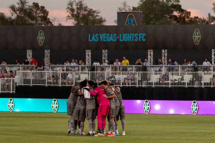 Members of the Las Vegas Lights FC huddle before a USL Championship soccer game against the Det ...