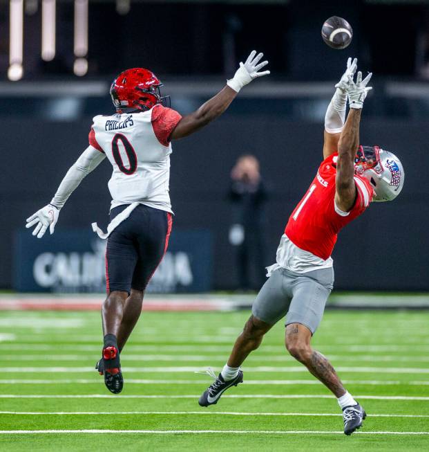 UNLV wide receiver Casey Cain (1) elevates for a reception attempt past San Diego State Aztecs ...