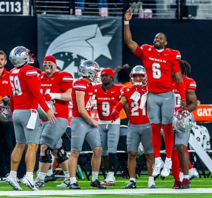 UNLV quarterback Hajj-Malik Williams (6) pumps up the defense while on the sidelines against th ...