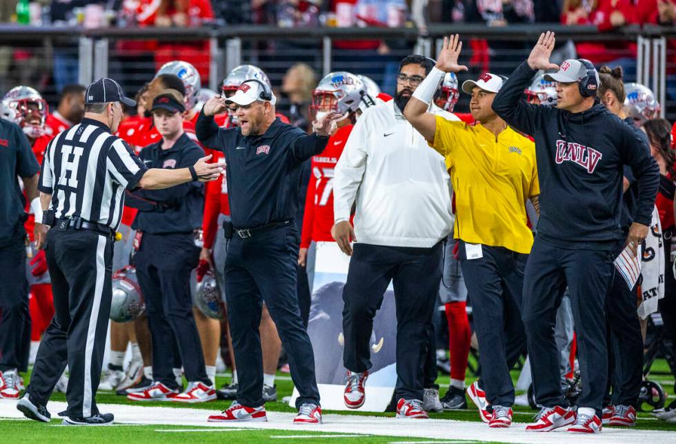 UNLV head coach Barry Odom makes his decision clear to an official against the San Diego State ...