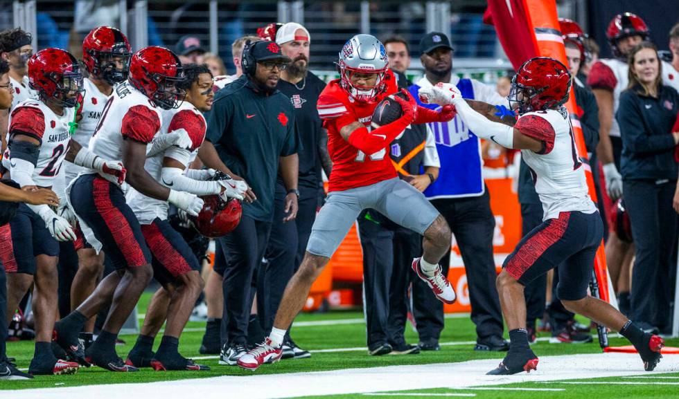 UNLV wide receiver Corey Thompson Jr. (13) is pushed out of bounds after catch by San Diego Sta ...