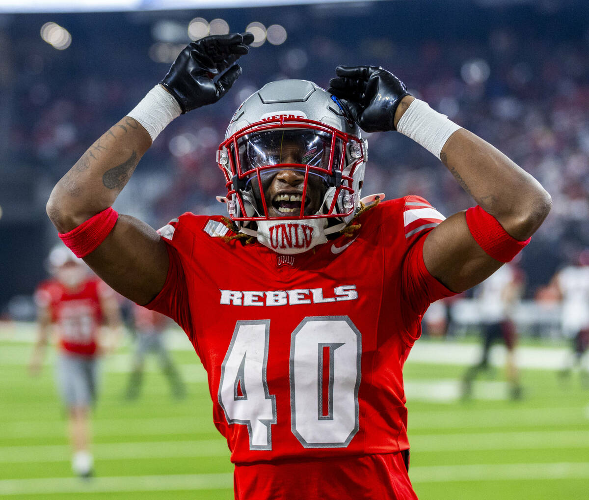 UNLV defensive back Daego Albert (40) is pleased with another great kickoff coverage against th ...