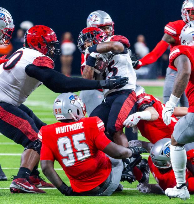 San Diego State Aztecs quarterback Danny O'Neil (5) is sacked by the UNLV defense during the fi ...