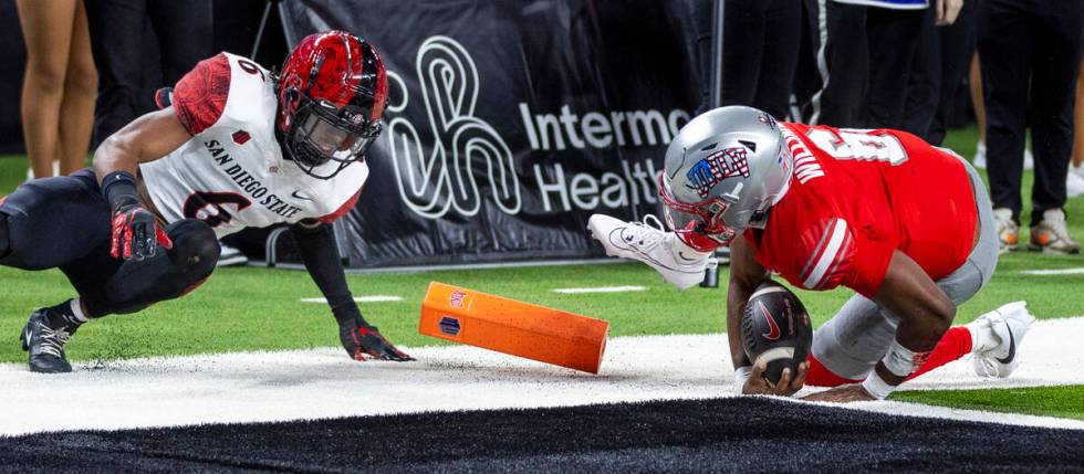 UNLV quarterback Hajj-Malik Williams (6) is just inches short of scoring as San Diego State Azt ...