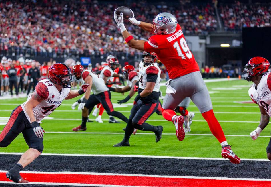 UNLV tight end Kaleo Ballungay (19) elevates for a touchdown reception as San Diego State Aztec ...