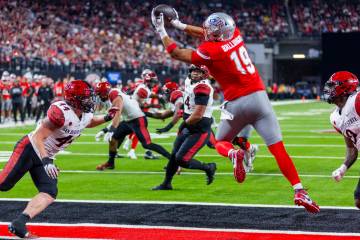 UNLV tight end Kaleo Ballungay (19) elevates for a touchdown reception as San Diego State Aztec ...