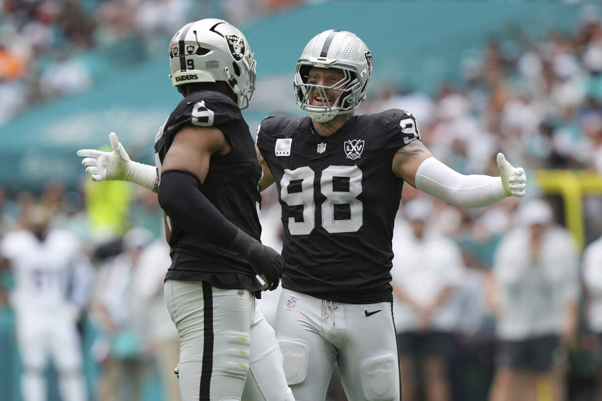 Las Vegas Raiders defensive end Maxx Crosby (98) celebrates a sack during the first half of an ...