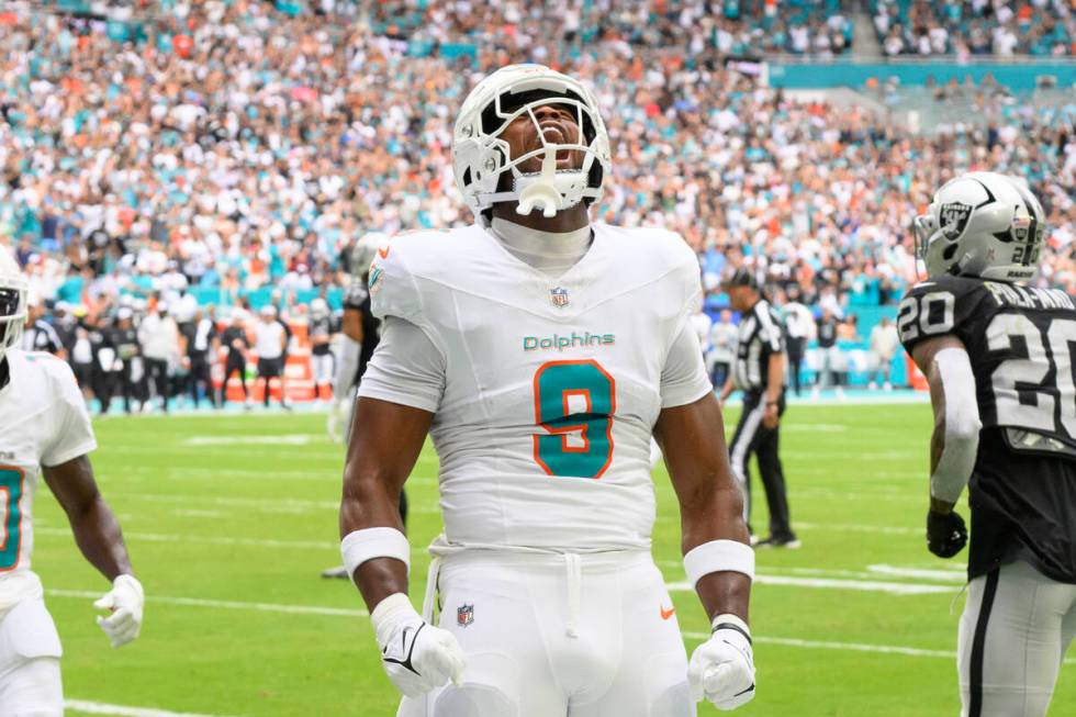 Miami Dolphins tight end Jonnu Smith (9) yells as he celebrates scoring a touchdown during an N ...