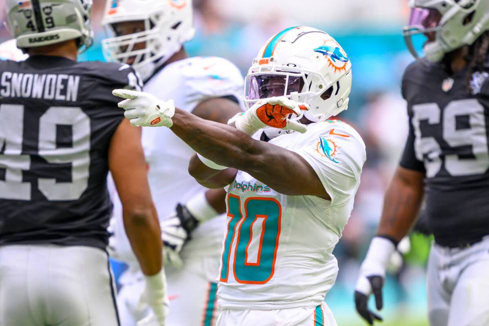 Miami Dolphins wide receiver Tyreek Hill (10) reacts as he celebrates a reception during an NFL ...