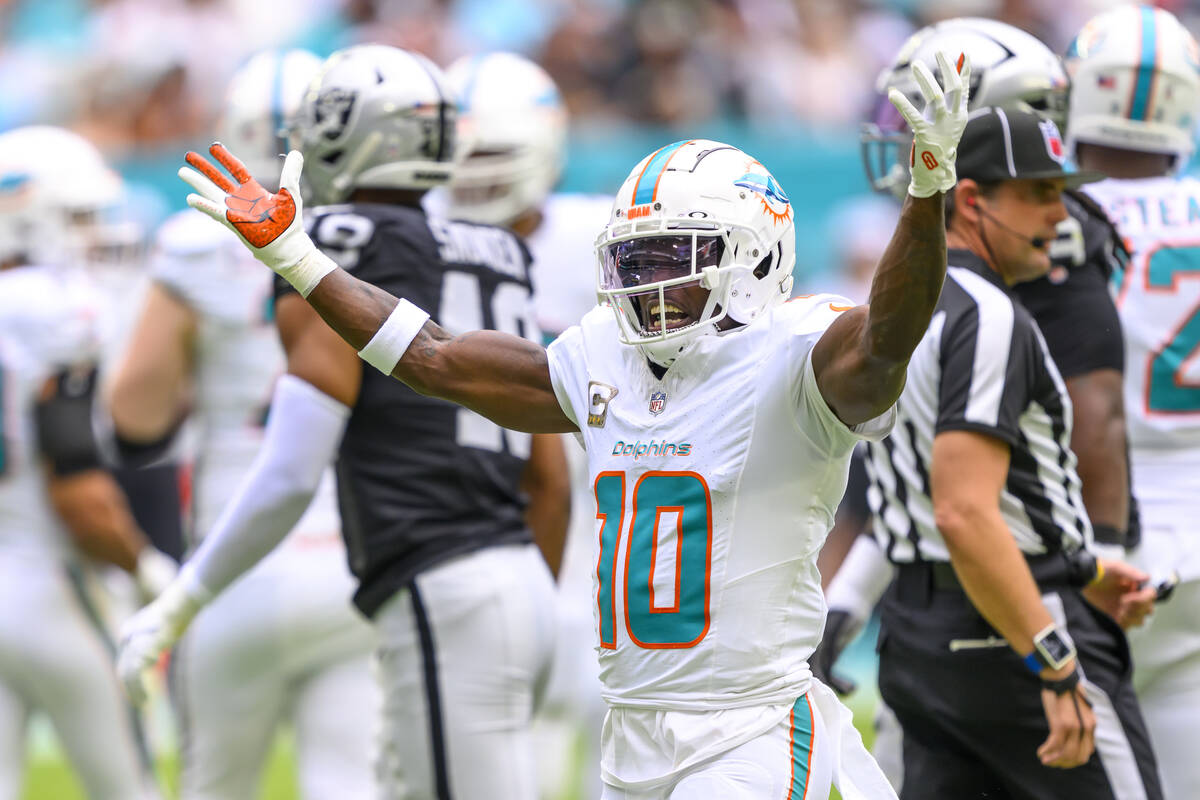 Miami Dolphins wide receiver Tyreek Hill (10) gestures as he celebrates a reception during an N ...