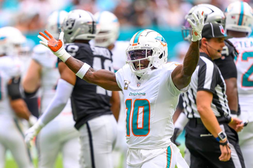 Miami Dolphins wide receiver Tyreek Hill (10) gestures as he celebrates a reception during an N ...