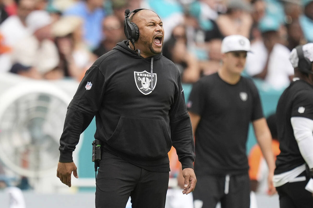 Las Vegas Raiders head coach Antonio Pierce yells during the first half of an NFL football game ...