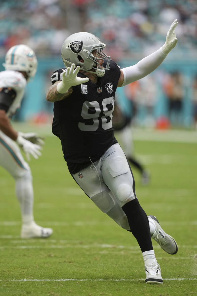 Las Vegas Raiders defensive end Maxx Crosby (98) runs a play during the second half of an NFL f ...